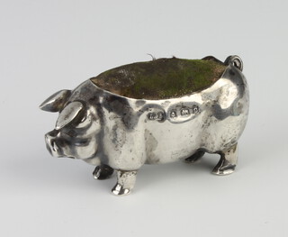 An Edwardian novelty silver pin cushion in the form of a pig Birmingham 1902, maker Levi and Salaman, 5cm 