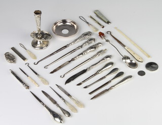 A collection of silver mounted sewing implements, spoons etc 
