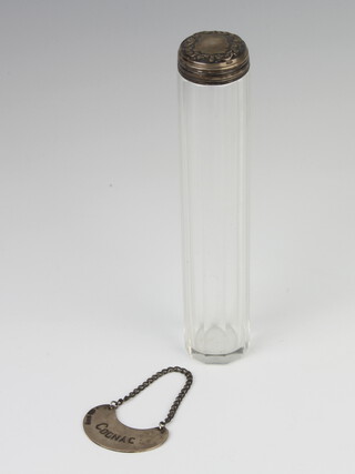 A silver cognac label Birmingham 1916 and a silver topped toilet bottle