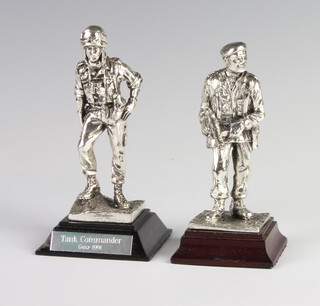 A silver filled figure of a tank commander, ditto of a soldier 11cm 
