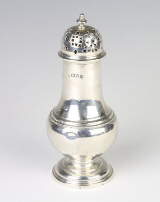A silver sugar caster of baluster form London 1929, 220 grams 