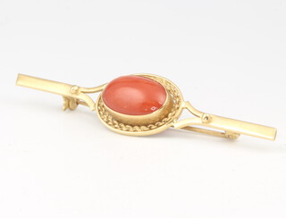 An 18ct yellow gold etruscan style cabochon cut oval coral brooch, 4.2 grams, 58mm 