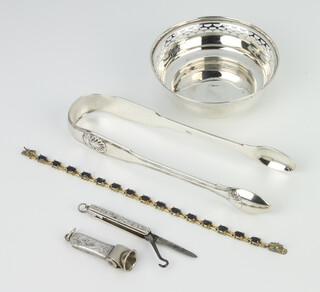 A pair of Victorian silver Kings pattern sugar tongs London 1824, ditto bowl, cigar cutter, pocket knife and silver and paste bracelet