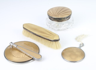 A silver and guilloche enamel mounted powder jar, ditto hair brush, both bruised together with a similar plated hand mirror and handbag mirror 