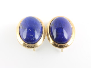 A pair of 18ct yellow gold oval cabochon cut lapis lazuli ear clips 8.3 grams, 16mm  