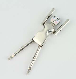 A pair of novelty silver and enamel sugar tongs in the form of a lady, London 1925, 9cm, 40 grams