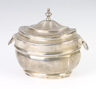 A Georgian silver Adam style tea caddy with urn finial and lion ring handles Glasgow marks rubbed, 12cm  