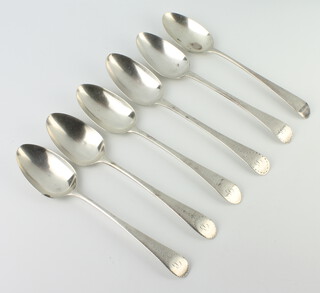Six Georgian silver table spoons with bright cut decoration, mixed dates, rubbed marks, 355 grams 