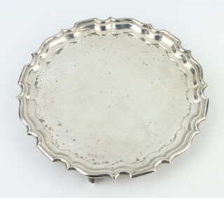 A silver card tray with Chippendale rim on scroll feet, Sheffield 1955, 20cm, 205 grams 
