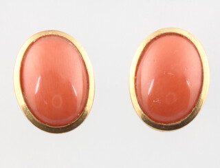 A pair of 18ct yellow gold oval cabochon cut coral ear studs 3.6 grams, 15mm 