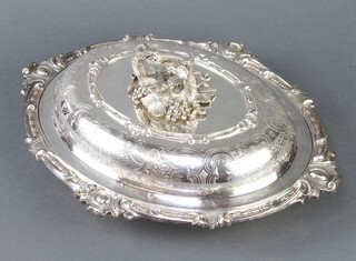 A Victorian silver plated entree dish with cast vinous handle and chased decoration 36cm 