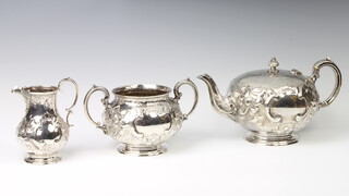 A Victorian silver 3 piece tea set with repousse floral decoration and vacant cartouches London 1874, gross 1299 grams 