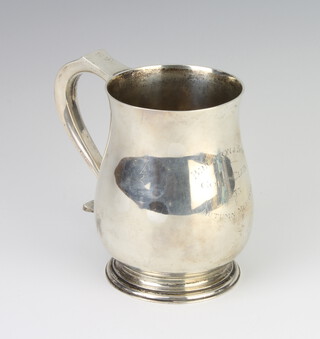 A silver baluster mug with S scroll handle London 1934, 427 grams