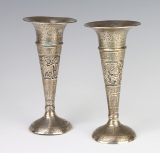 A pair of Eastern silver tapered posy vases decorated with flowers and figures 17cm 260 grams