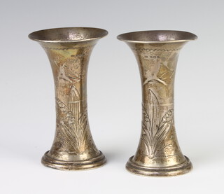 A pair of silver Art Nouveau flared neck vases decorated with flowers Birmingham 1912, 12cm, with weighted bases