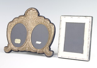 A modern double repousse silver photo frame 18cm, a rectangular ditto rubbed marks 