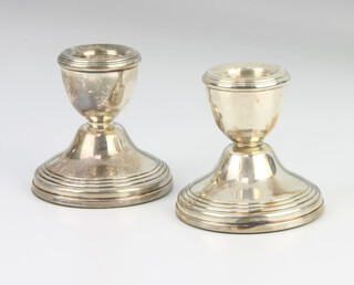 A pair of turned silver dwarf candlesticks 1993, 6cm 