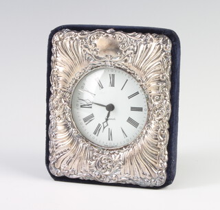 A silver repousse quartz timepiece, rubbed marks, 11cm 