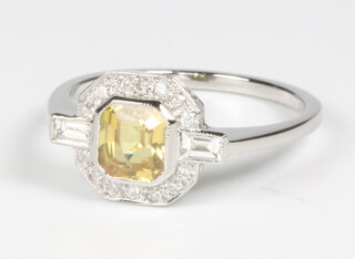 A platinum Art Deco style yellow sapphire and diamond ring the centre stone approx. 1.2ct, size O, 4.1 grams 