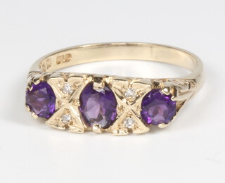 A 9ct yellow gold amethyst and diamond ring size O, 2.5 grams