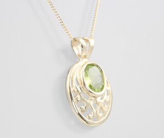 A 9ct yellow gold oval peridot pendant on a ditto 46cm chain, 2.4 grams