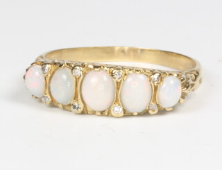 An 18ct yellow gold 5 stone opal and diamond ring, 4.5 grams, size Q 1/2