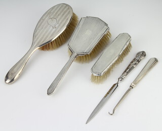An Art Deco silver backed hair brush and clothes brush rubbed marks, 3 other mounted items