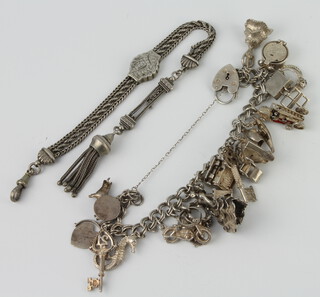 A silver charm bracelet and an Albert 97 grams