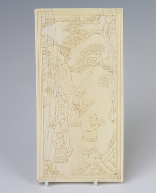 A late 19th Century carved ivory table screen in the form of a figures with deer in an extensive landscape with distant mountain, script on reverse and a butterfly amongst flowers 20cm x 10cm 