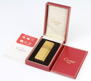 A gentleman's gold plated cased Cartier cigarette lighter 