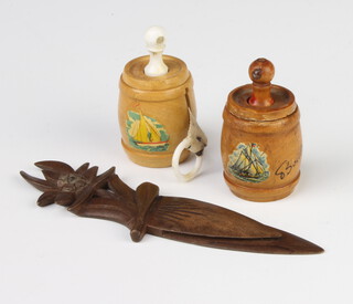 A Victorian fruitwood Stanhope tape measure in the form of a barrel with view of Calais, ditto Boulogne and a carved wood paper knife France 