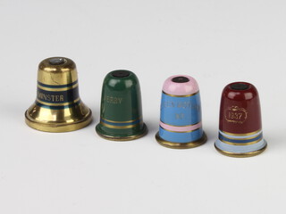 Two modern metal wood settons in the form of thimbles with commemorative scenes and 2 others 