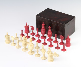 A 19th Century turned and stained bone chess set, the king 9.5cm, contained in a mahogany box 