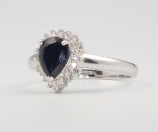 An 18ct white gold pear cut sapphire and diamond cluster ring, centre stone 1.37ct, surrounded by brilliant cut diamonds 0.16ct, size P 