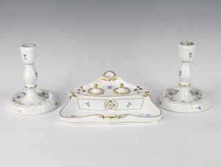 A Herend Hvngary inkstand with 2 inkwells and pen tray together with matching candlesticks decorated with flowers 