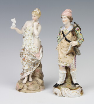 A 19th Century German porcelain figure of a lady holding a portrait bust of a classical lady raised on a rocky base 20cm, a ditto of a gentleman hunter holding a dead deer over his shoulder 20cm 