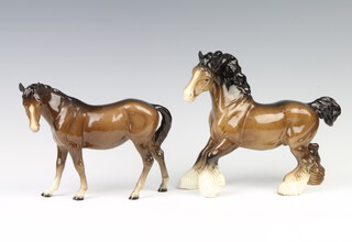 A Beswick figure Cantering Shire, brown gloss no. H975 22.2cm together with a mare facing left no.976 brown gloss, 17.2cm, both modelled by Arthur Gredington  