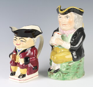A 19th Century Staffordshire Toby jug 23cm and a later ditto 17cm  