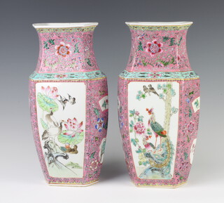 A pair of 18th Century style Chinese pink ground hexagonal tapered vases decorated with panels of exotic birds with red character mark to base 35cm 
