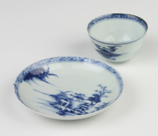 A Nanking Cargo tea bowl and saucer decorated with landscape views, having original Christies label on verso 