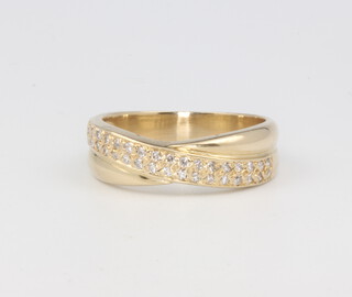 An 18ct yellow gold crossover diamond ring 5.6 grams, size P 