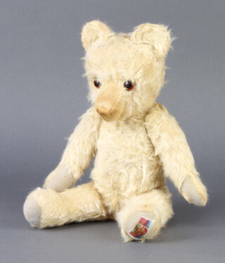 An Alpha yellow teddy bear with articulated limbs 33cm 
