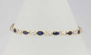 A 9ct yellow gold diamond and sapphire bracelet 18cm, 6.6 grams