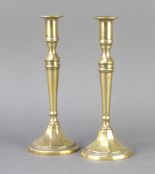 A pair of 19th Century brass candlesticks 25cm x 10cm 