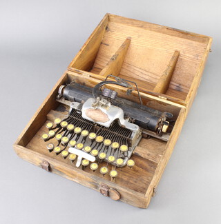 A Blick aluminium featherweight typewriter complete with carrying case (there is light rust to the carriage and in places, leather strap to case is missing) 