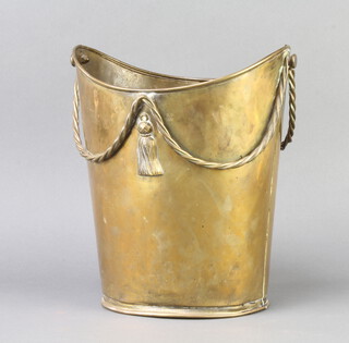 A Regency style boat shaped brass wastepaper bin with swag decoration 28cm x 24cm x 21cm, base marked Made In England 