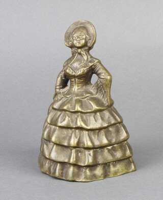 A 19th Century bronze bell in the form of a crinoline lady, the clapper in the form of legs 12cm x 8cm x 7cm  