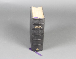 A leather bound Holy Bible printed in 1905, 8cm h x 23cm w 29cm l