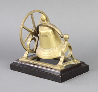 A brass table bell raised on ebony base 17cm x 18cm x 12cm 