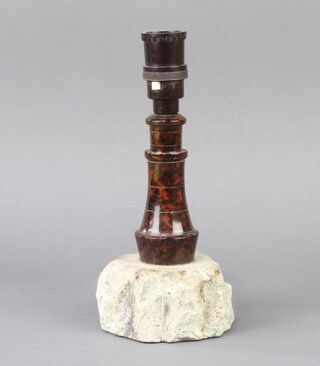 A 1930's turned and carved Cornish serpentine table lamp in the form of a lighthouse 23cm h x 10cm d x 10cm w  